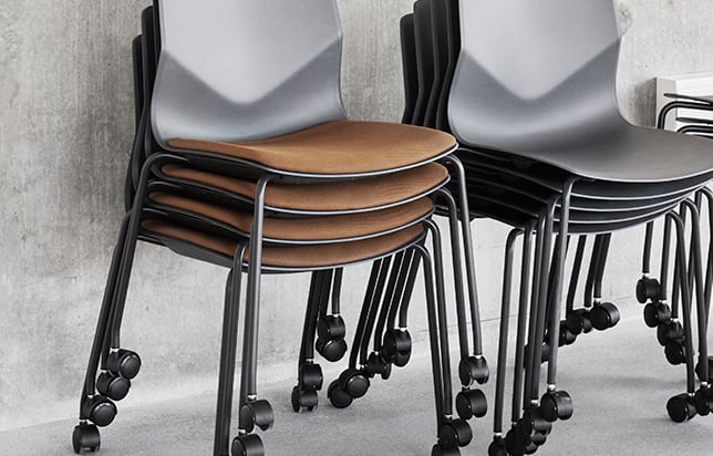stacked office desk chairs with wheels