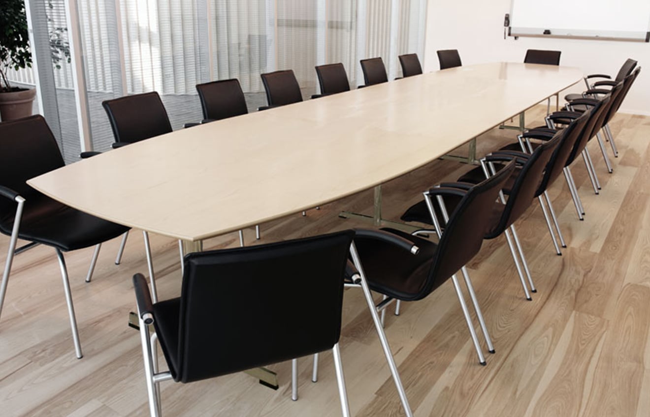 A long conference table in a conference room.