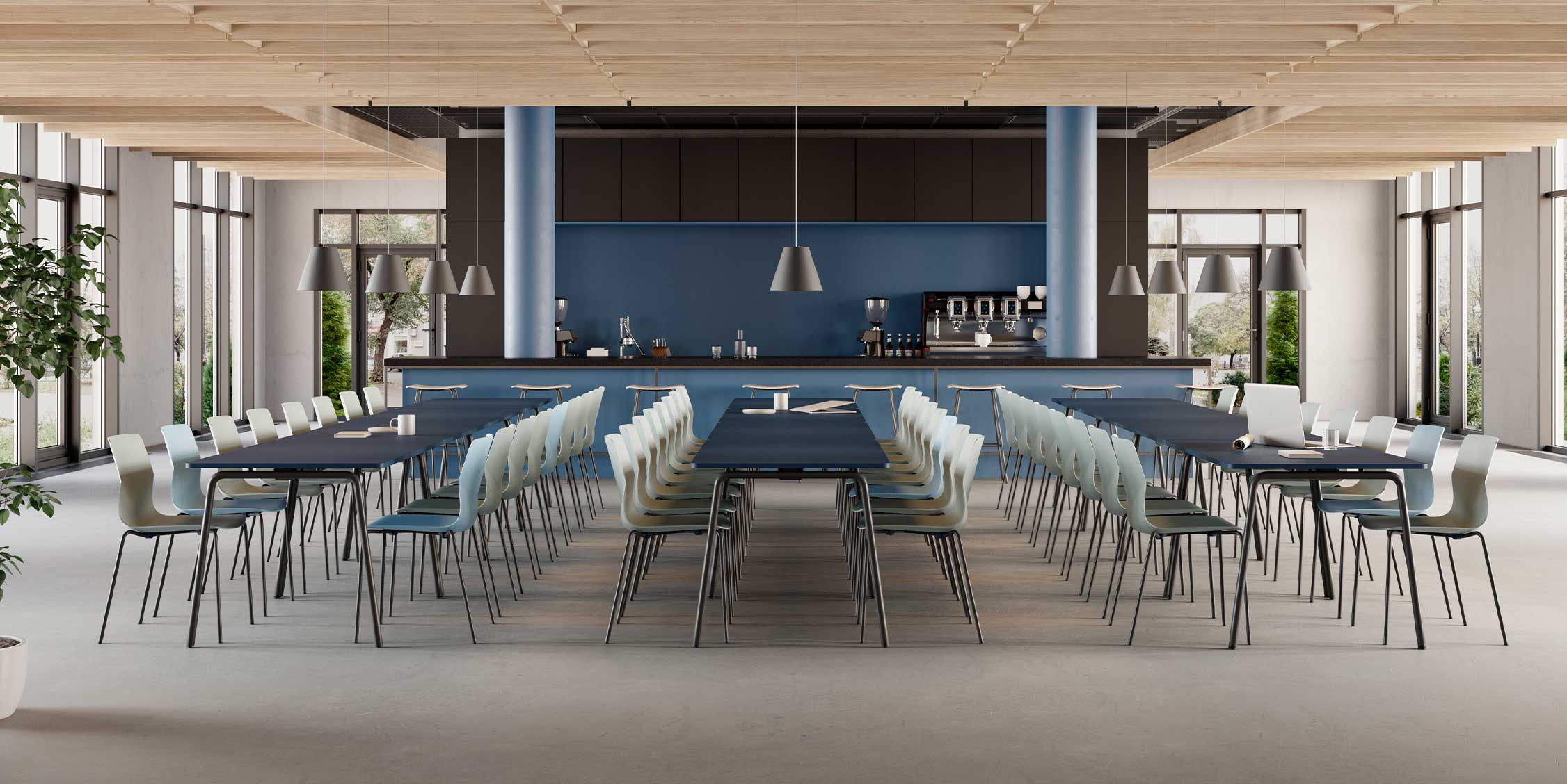 Canteen furniture in a dining room with a long table and chairs.