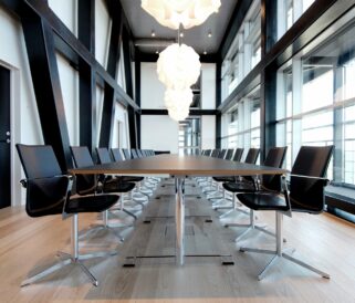 A conference room with a table and chairs.