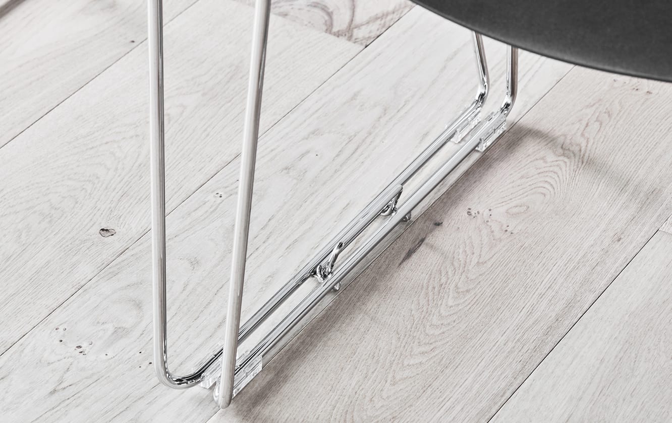 Detail of black office desk chairs's legs attached