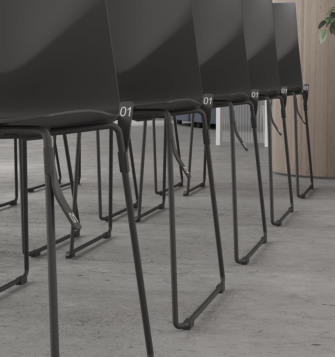 A row of black chairs in a conference room.