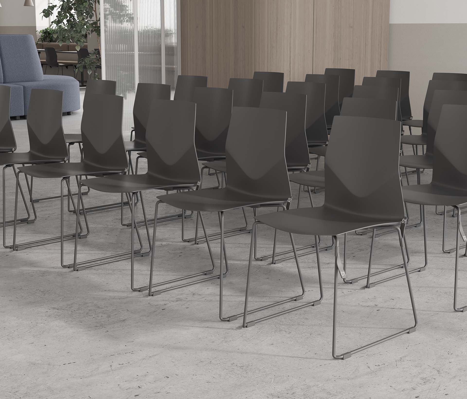 A row of gray chairs in a room.