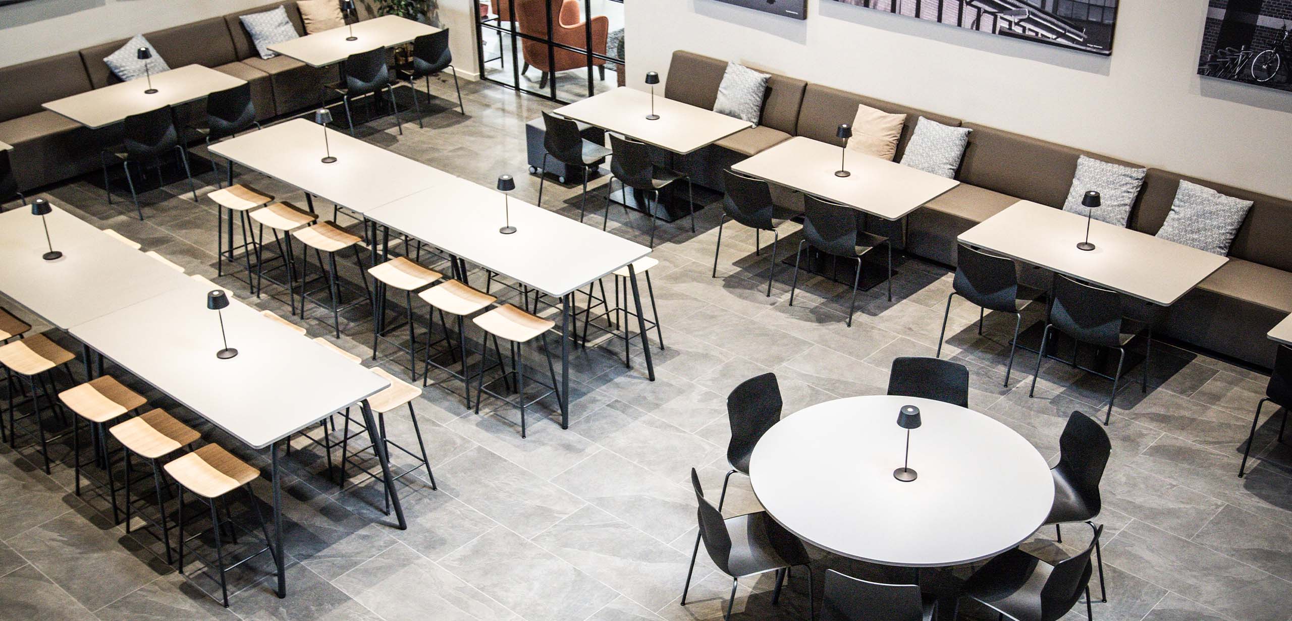 Canteen furniture in a canteen with tables and chairs.