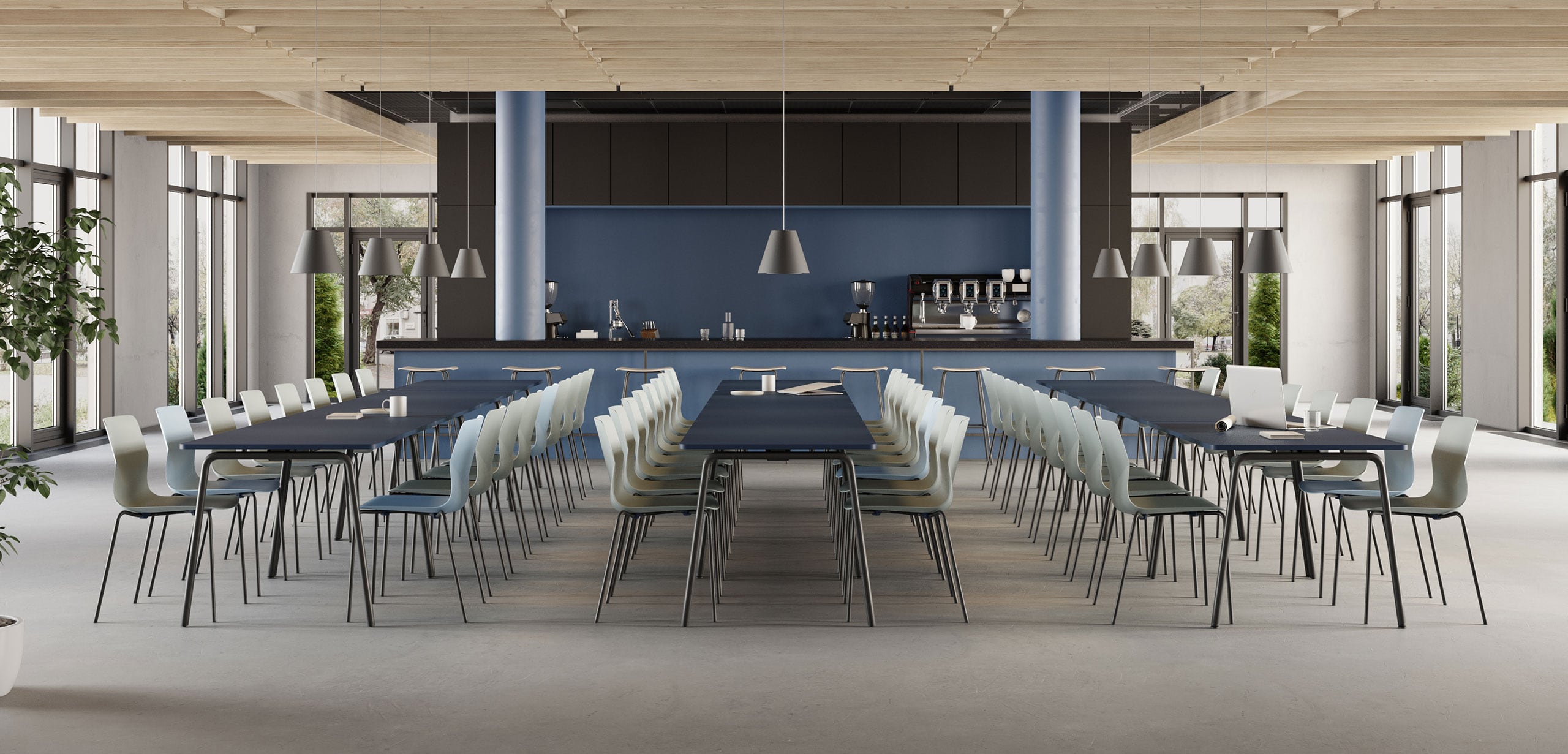 Canteen furniture in a dining room with a long table and chairs.