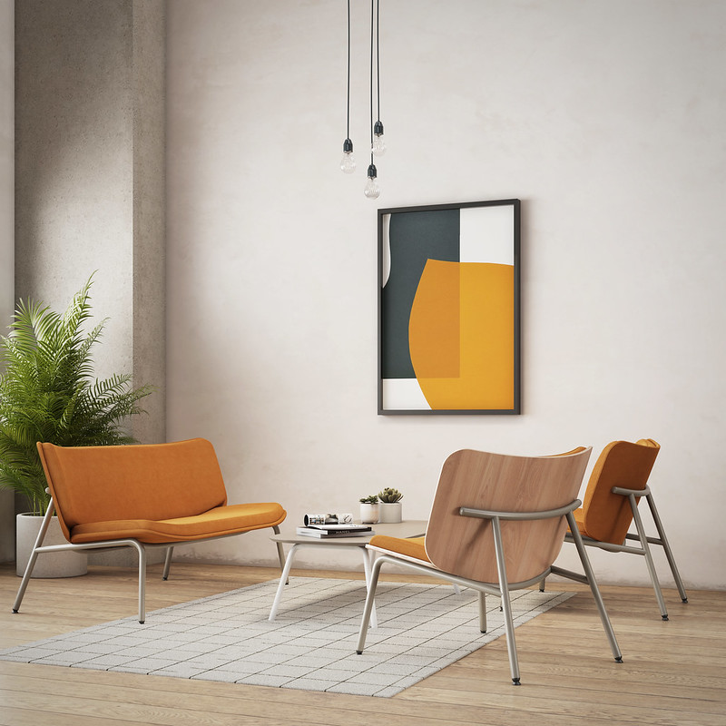 A living room with orange FourAll Lounge chairs for office and a painting on the wall.