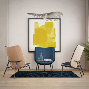 Three FourAll Lounge chairs for office in a room with a yellow painting.