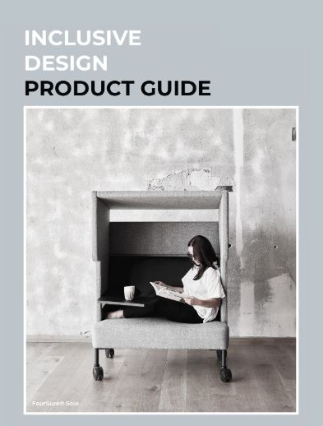 A woman seated at a work booth, featured on the front cover of an inclusive design guide.