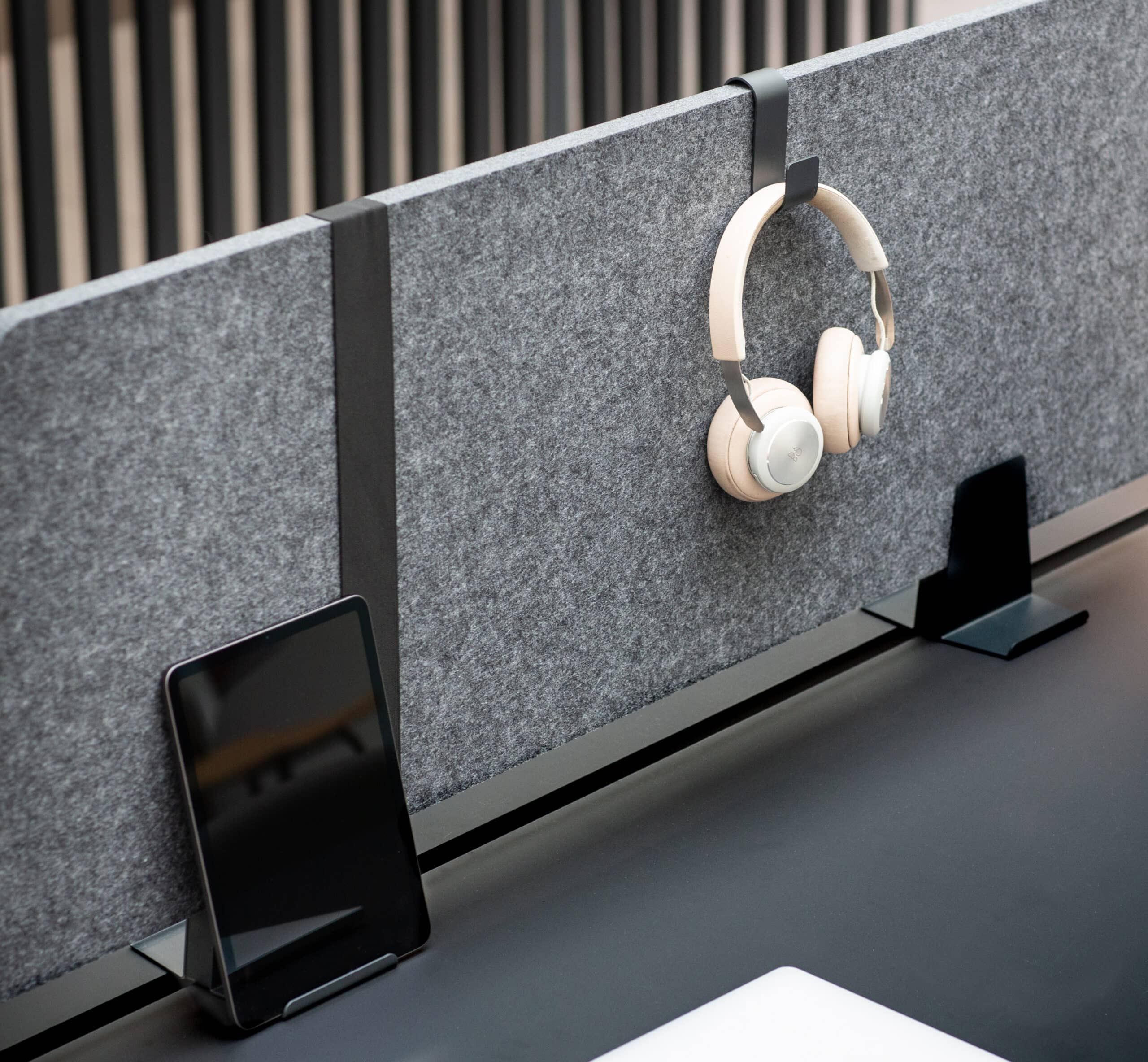 Acoustic panel with headphones and ipad