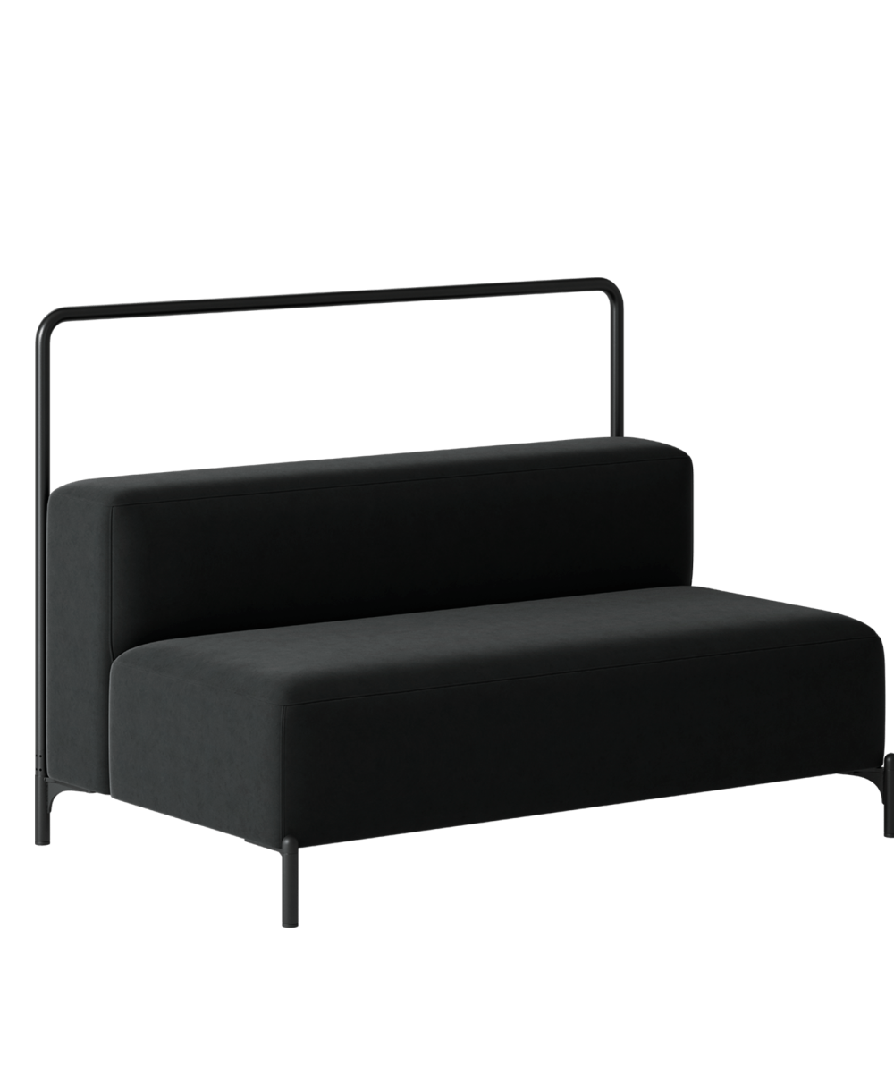 A black sofa with a metal frame on a green background.