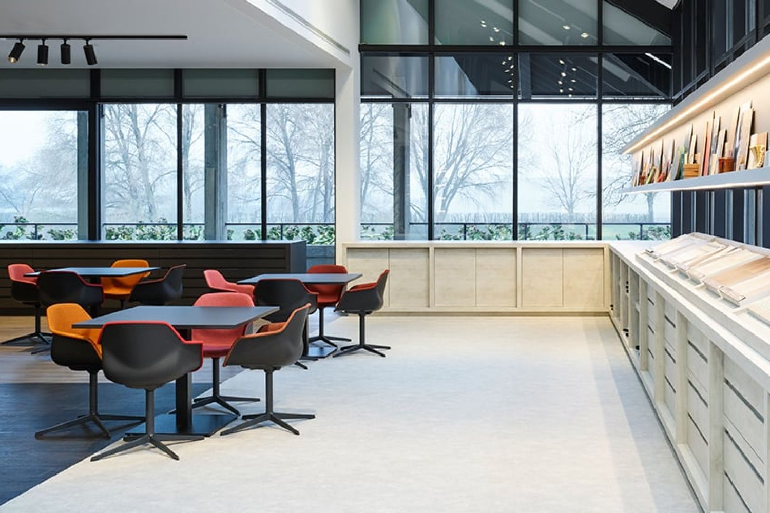 An office with pedestal tables and chairs in the middle of a large room.