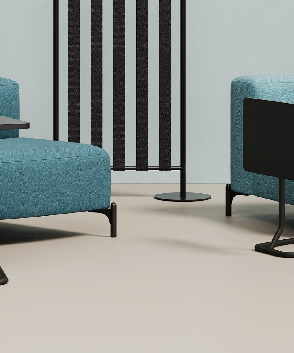 Modular seating office sofas with office screen divider and adjustable height work tables.